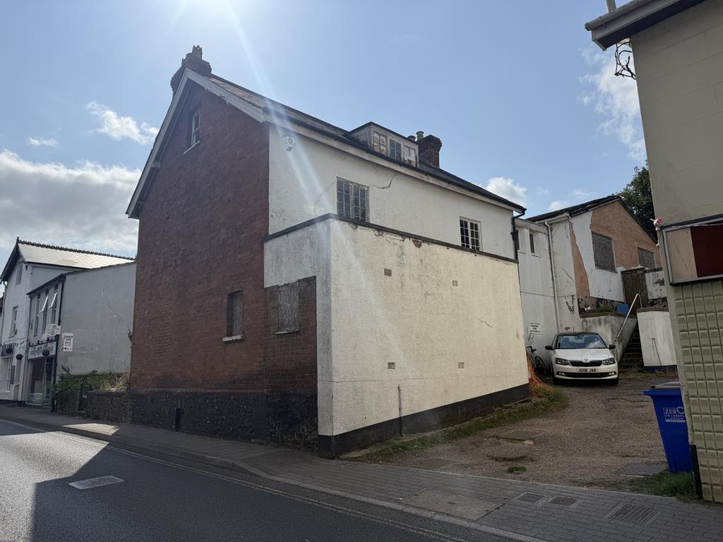 Lot: 86 - FORMER COMMERCIAL PROPERTY WITH PLANNING PERMISSION FOR RESIDENTIAL CONVERSION - Main photo of the side and rear of the property